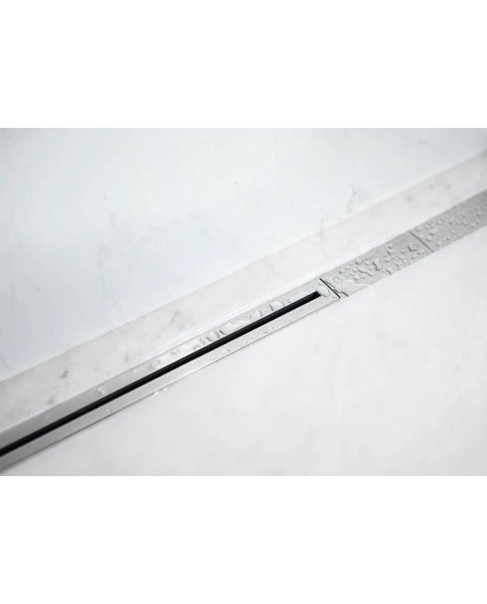 Caniveau drain Twiggi Carrodrain en inox, design minimaliste et élégant, intégré au sol.