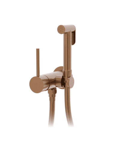 Douchette WC ST25S Cifial en finition cuivrée avec poignée ronde et tuyau flexible.