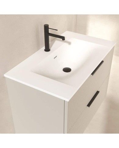 Meuble Gaban Odesign en blanc avec vasque intégrée et finition rainurée, robinet noir.